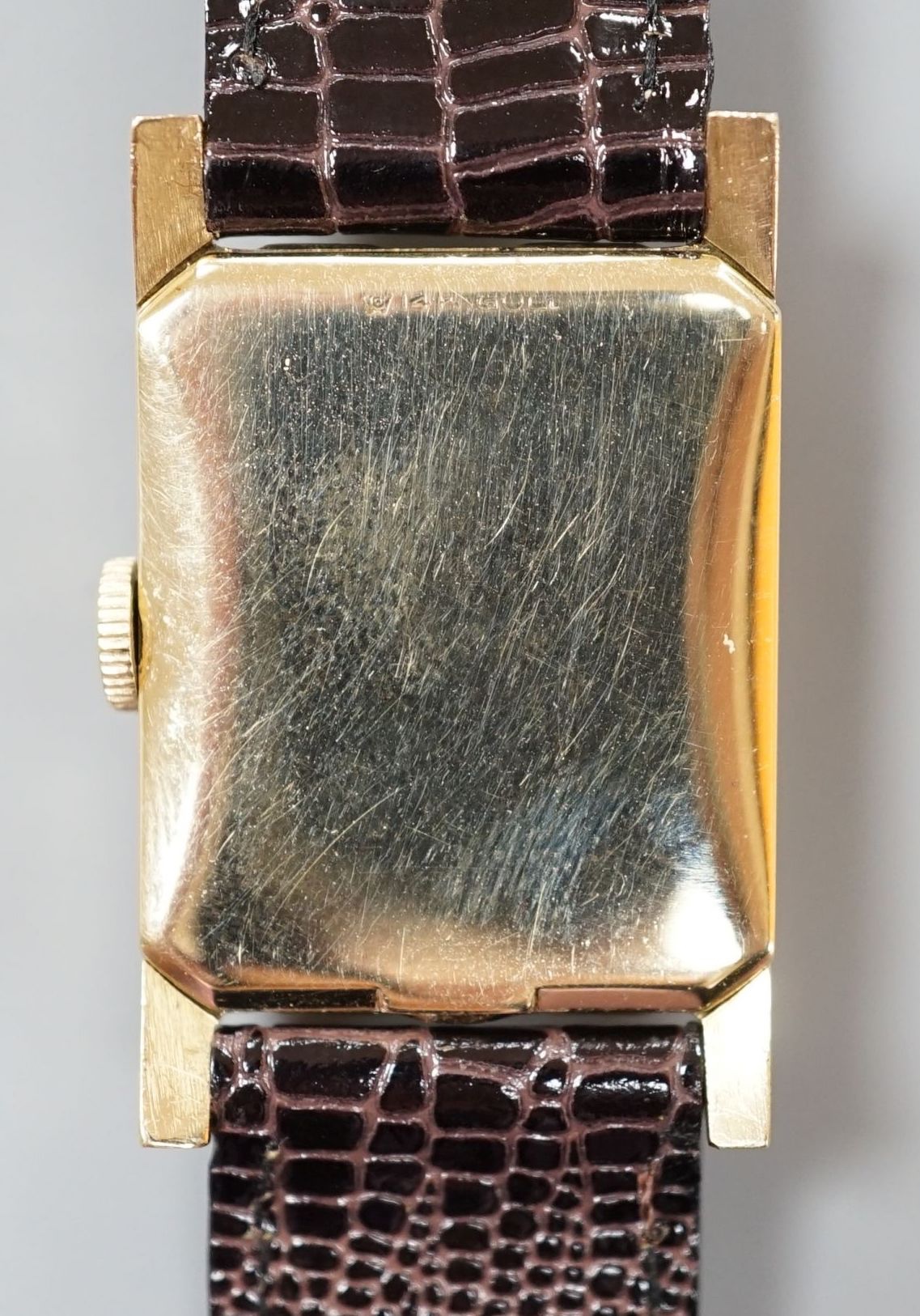 A gentleman's 1950's 14ct Lord Elgin manual wind wrist watch, with angular glass, Arabic dial and subsidiary seconds, on later leather strap, case diameter 23mm, gross weight 24.7 grams.